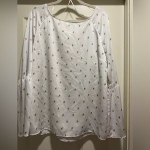 So pretty flowing silky blouse with embellished sleeves.